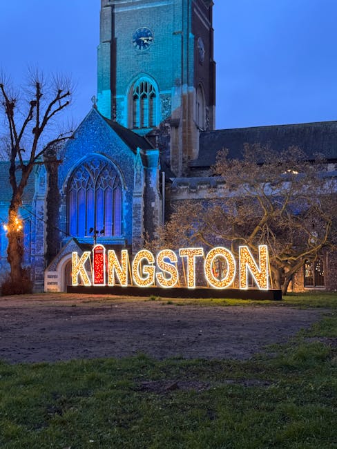 At dusk, a floral arrangement featuring vibrant, fresh flowers is held by a person in front of a church with Gothic architectural details and large stained glass windows, illuminated by soft lighting.
